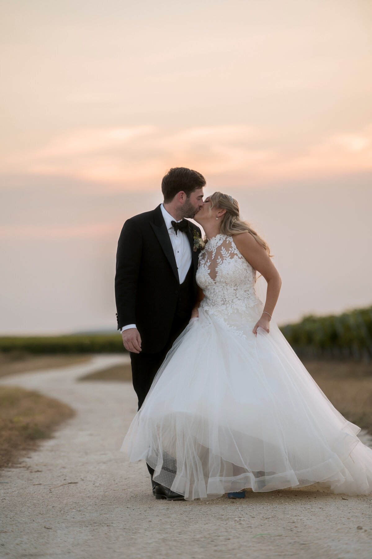 bride-groom-kissing-sunset