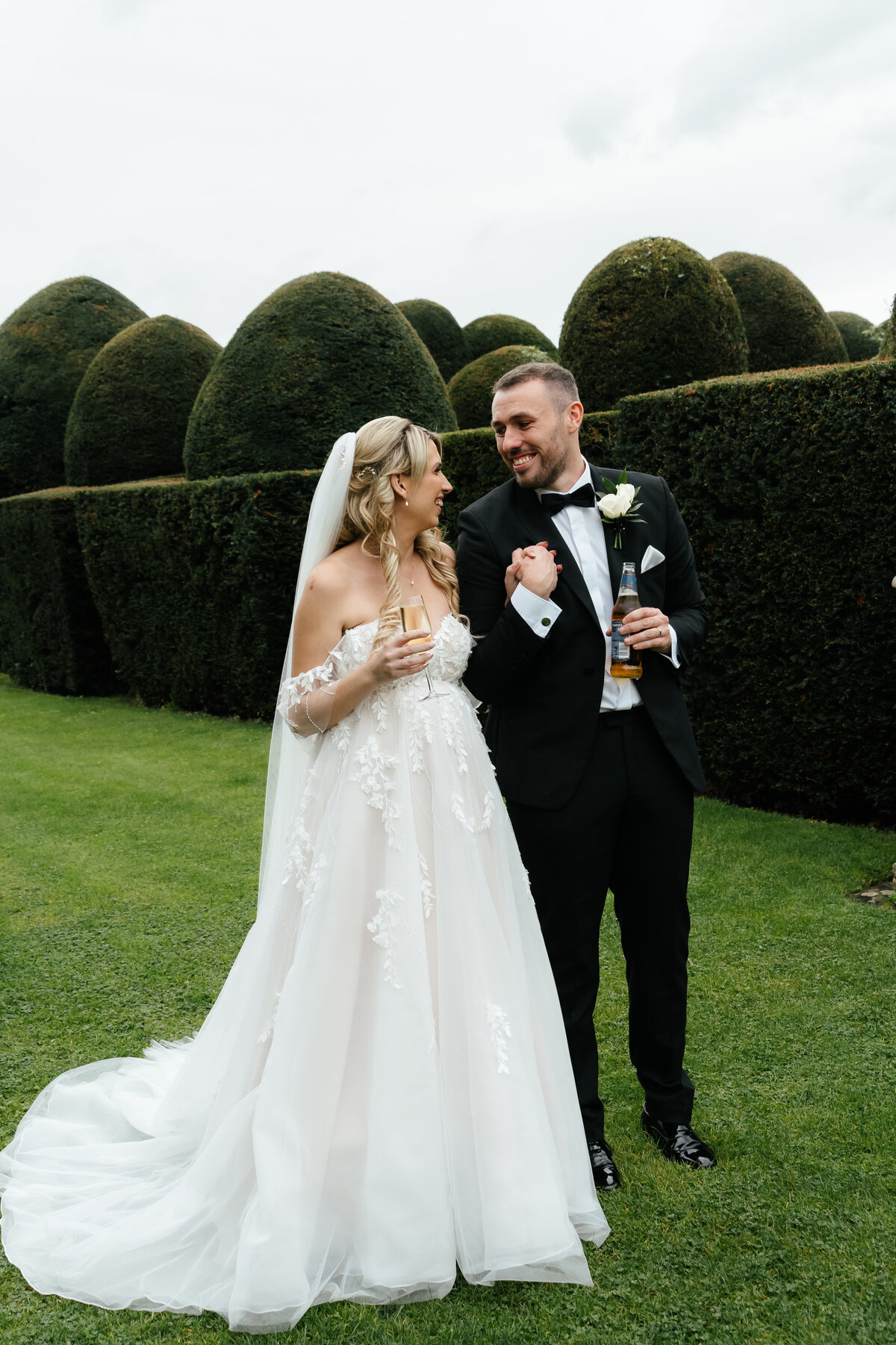 Bride-And-Groom-Hold-Hands-Champagne