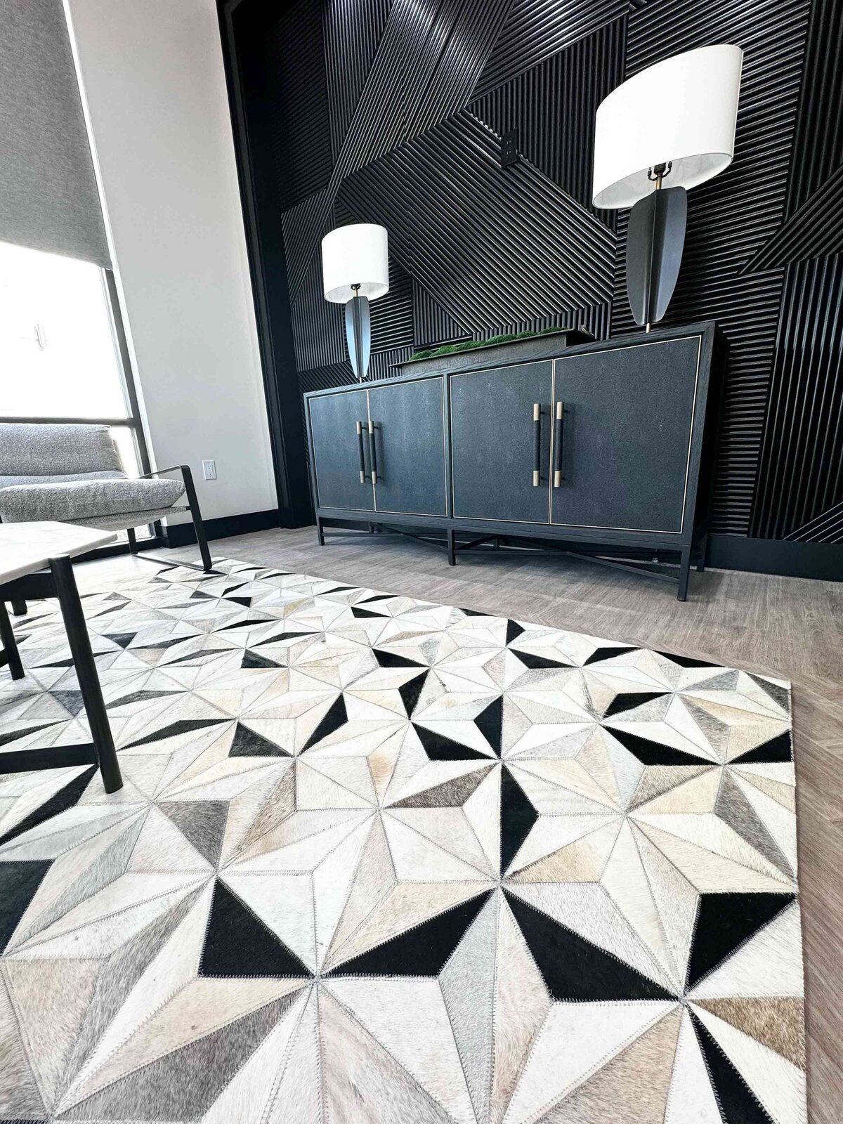 Stylish and functional living room interior featuring a textured carpet, adding warmth and depth to the space with modern furnishings and décor.