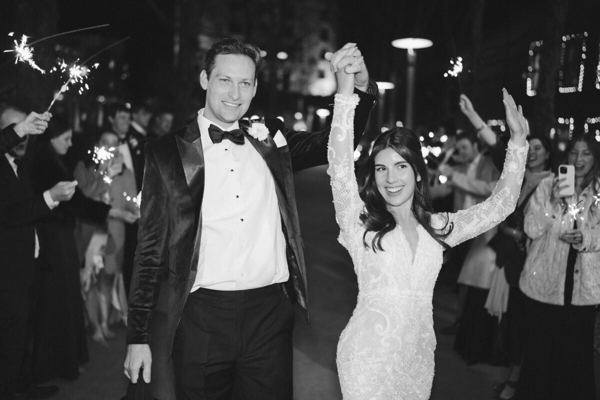 Bride and groom walking hand in hand down the street laughing, taken by Asheville Wedding Photographer Simon Anthony Photography