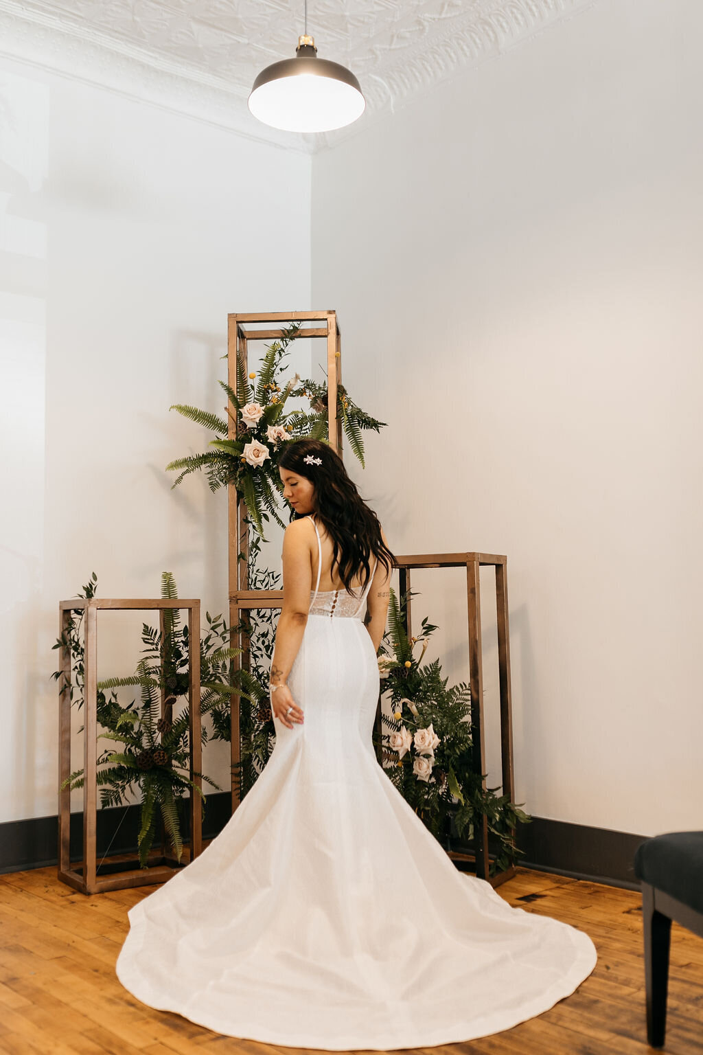 Gladys's short train makes this textured mermaid wedding dress a good fit for a more intimate ceremony venue.