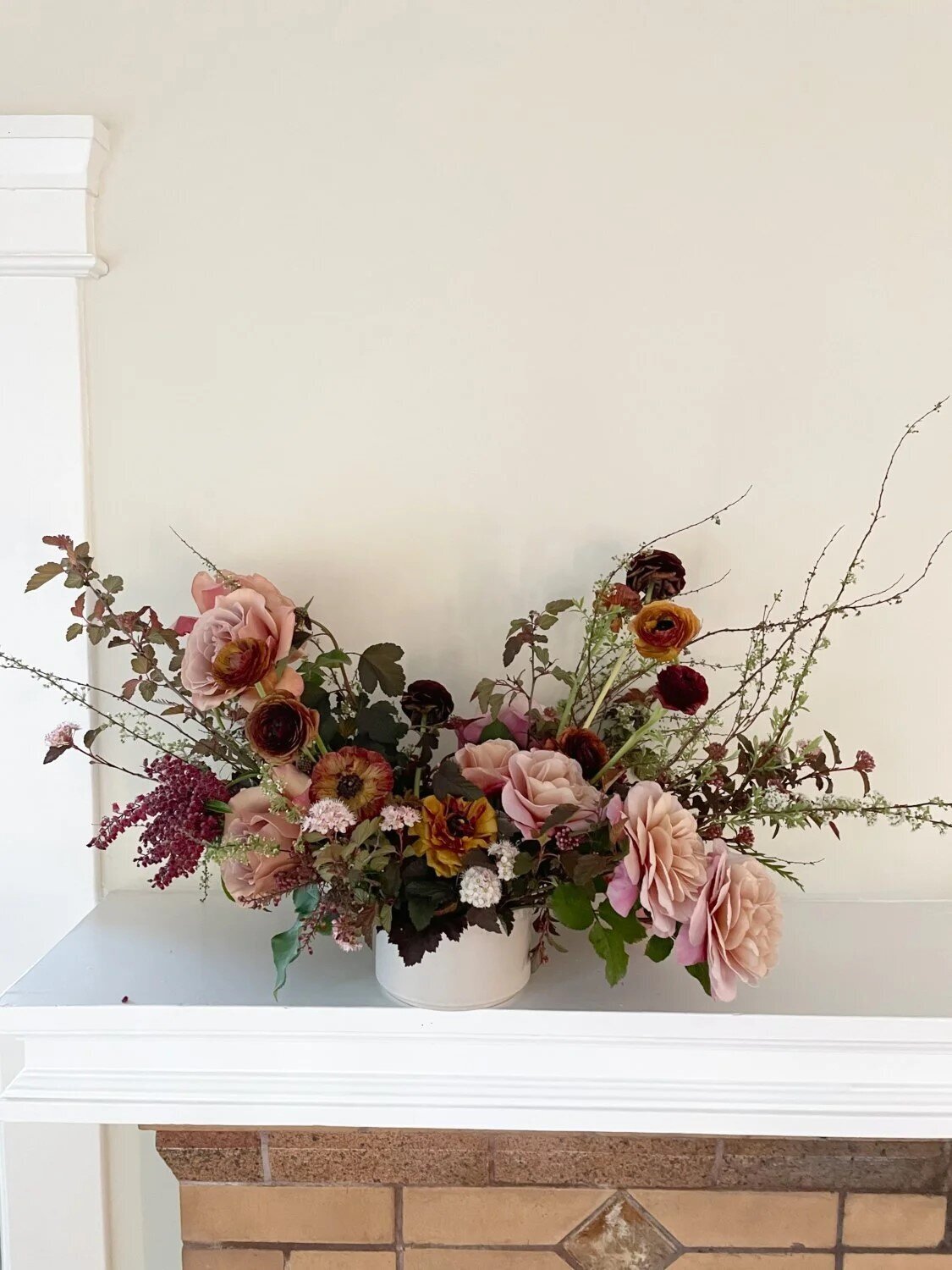 lush centerpiece with luxury cascading garden roses and ranunculus