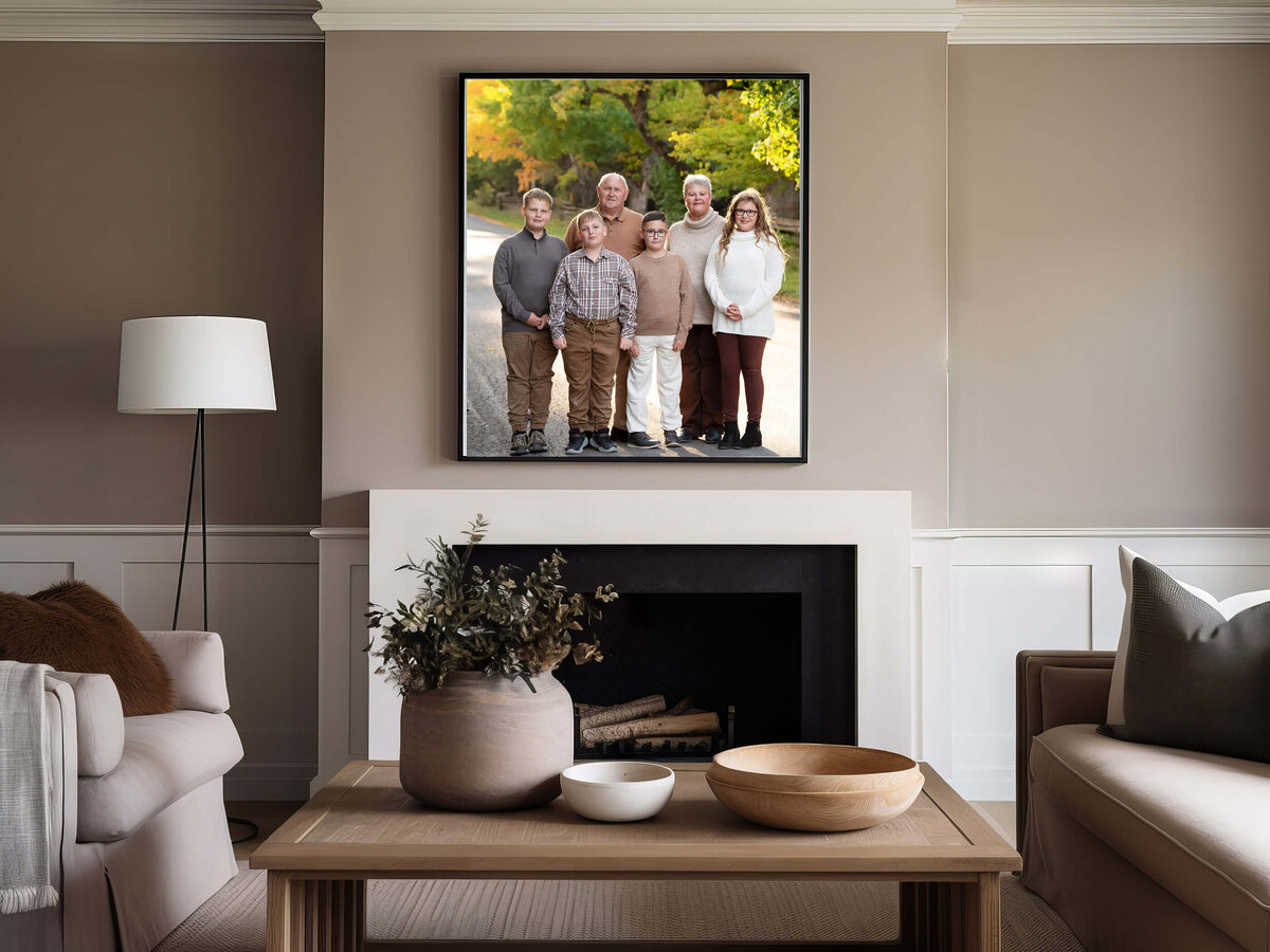 living room with a fireplace and a framed photo of grandparents with their grandchildren for there extended family photos in Burlington, ON