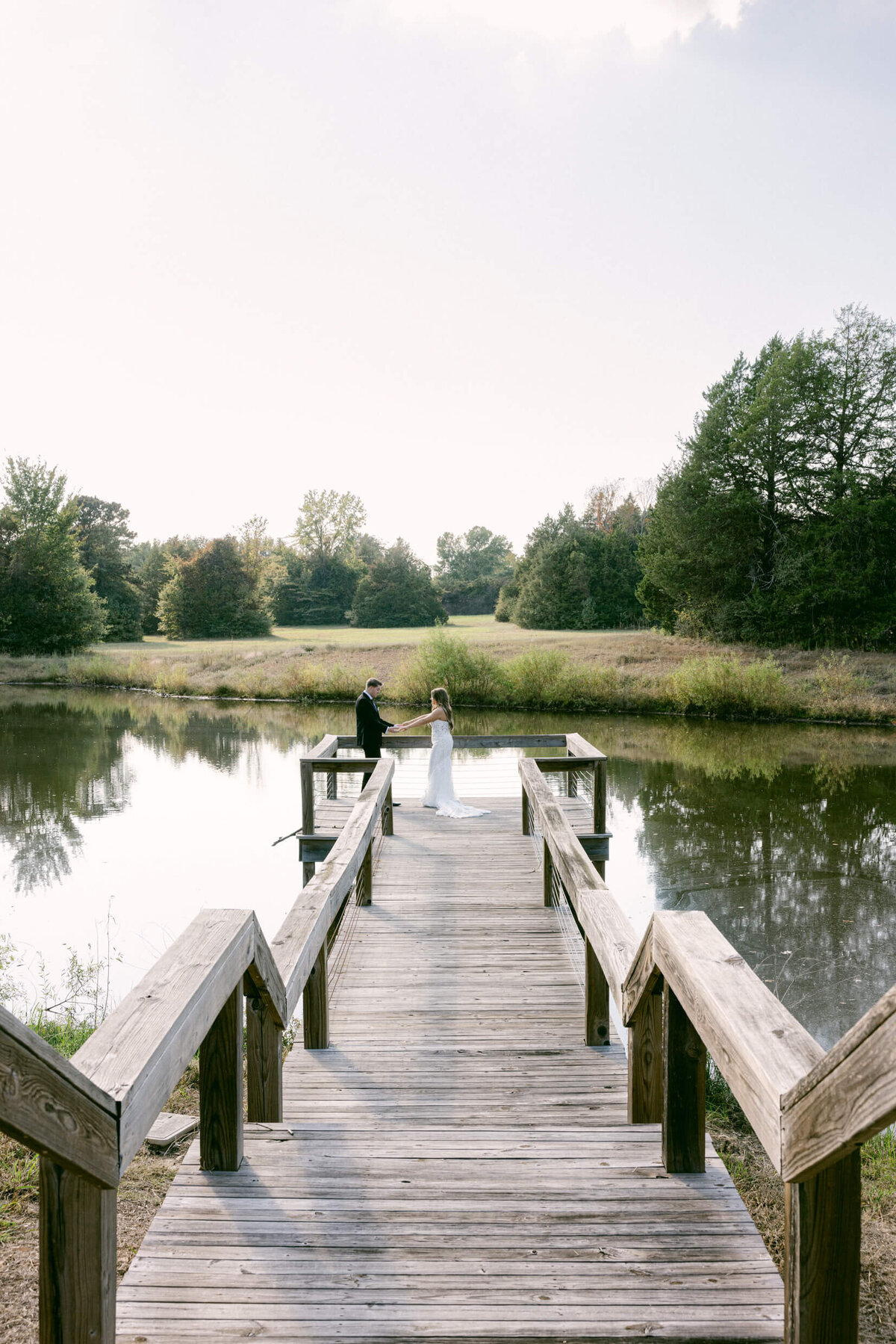A wedding photo of a bride and groom during their first look