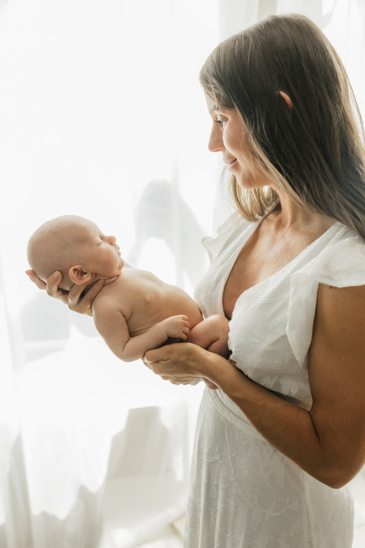 mom-in-baby-nursery-holding-baby