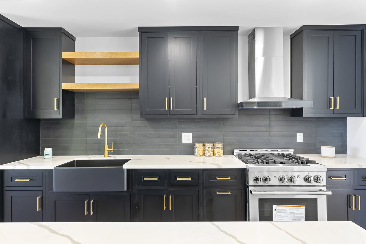 moody-black-kitchen-gold-fixtures-dark-tile-backsplash