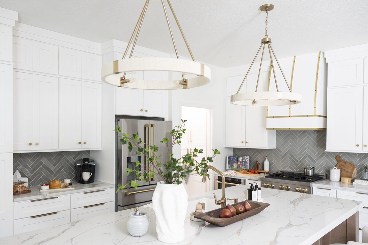 dewine design orlando interior designer belle isle kitchen with marble island and herringbone backsplash