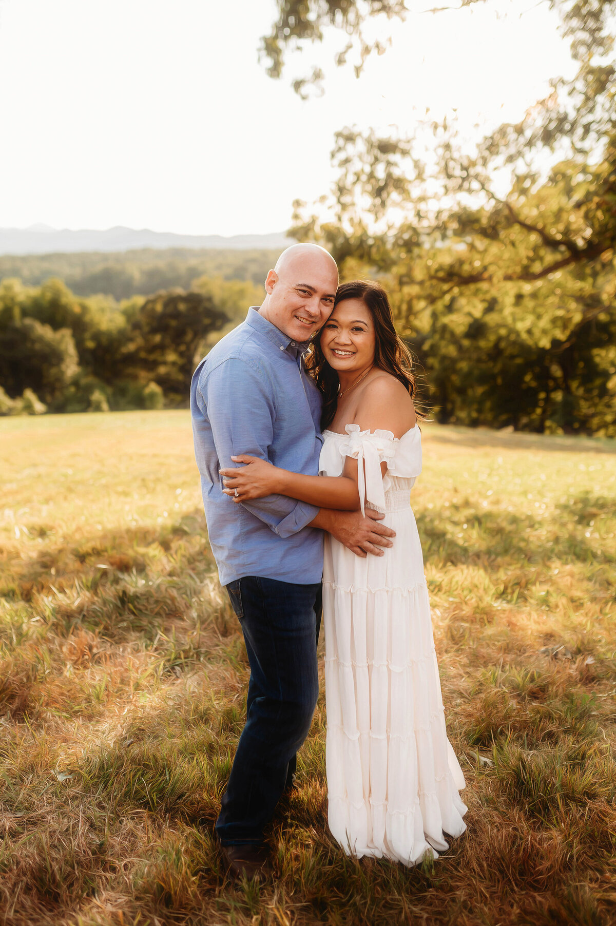 Couple embraces each other during Family Photos at Biltmore Estate in Asheville, NC.