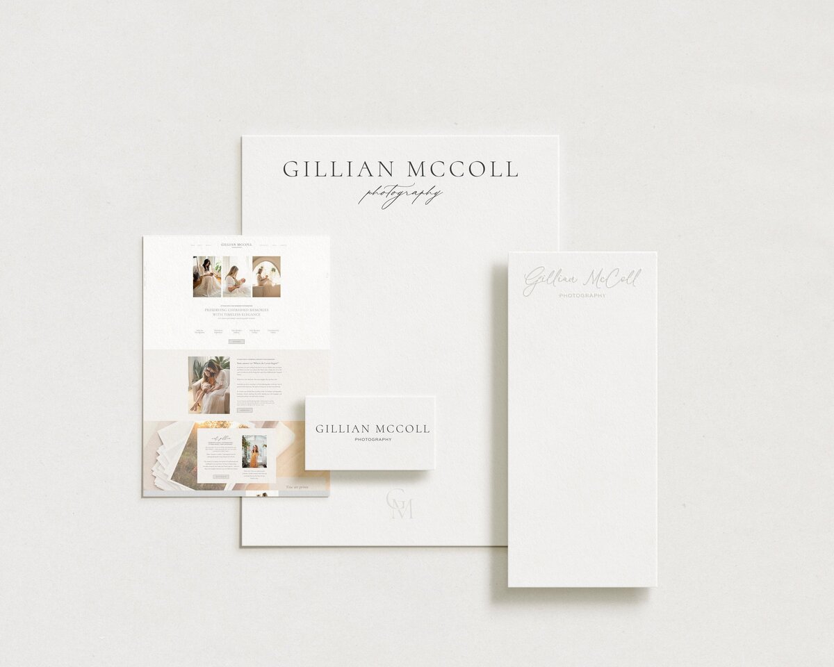 A set of photography branding materials including a business card, brochure, and stationery, all featuring grey text on white backgrounds. Our brand identity design services ensure a cohesive and professional look across all your marketing assets.