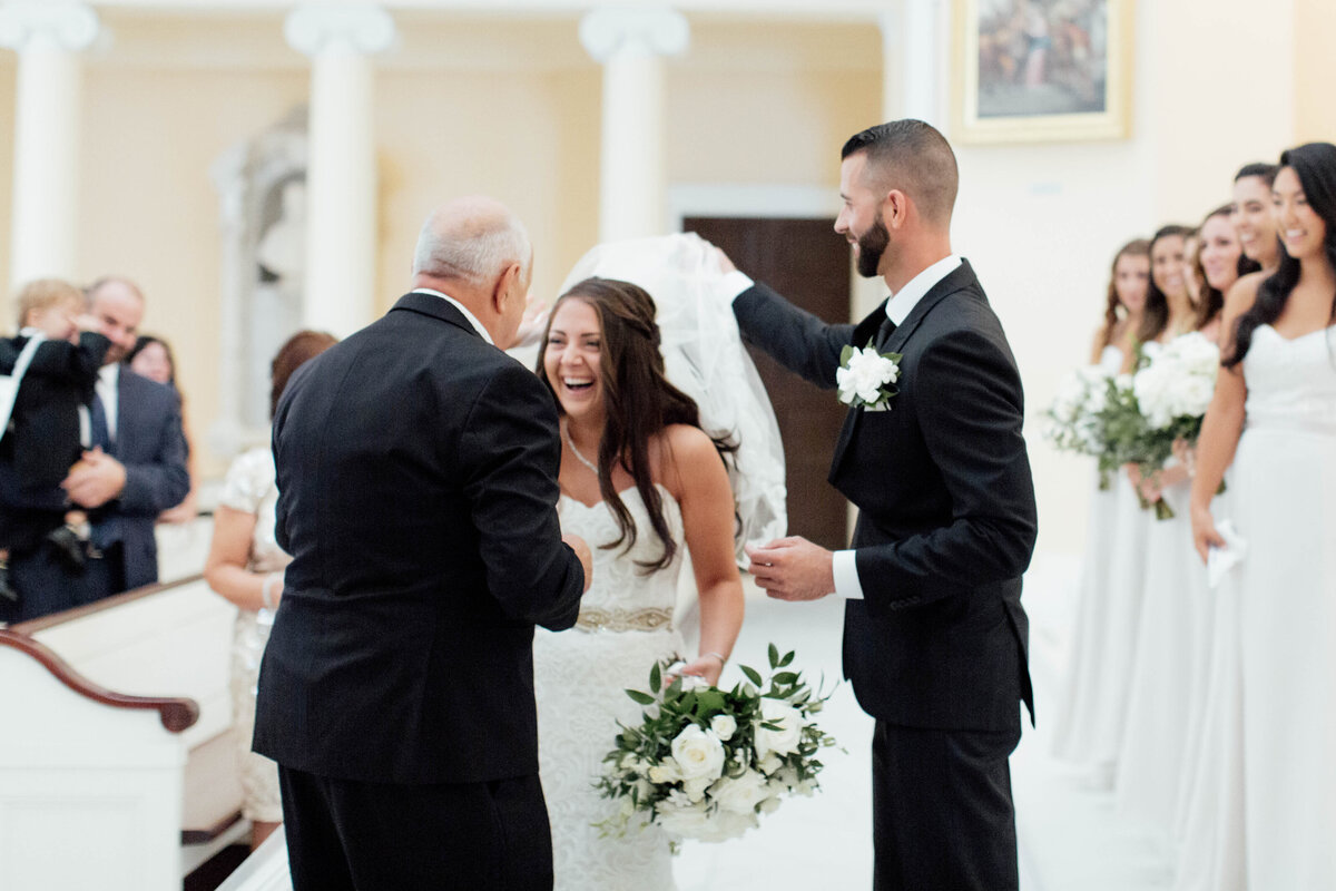 Bride laughing and enjoying the ceremony.