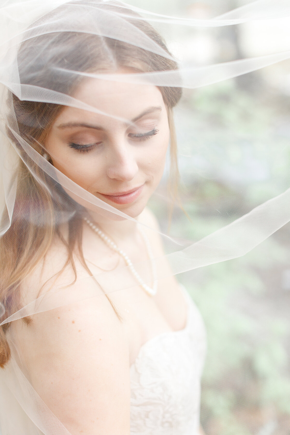 bride through  veil by Austin wedding photographer Firefly Photography