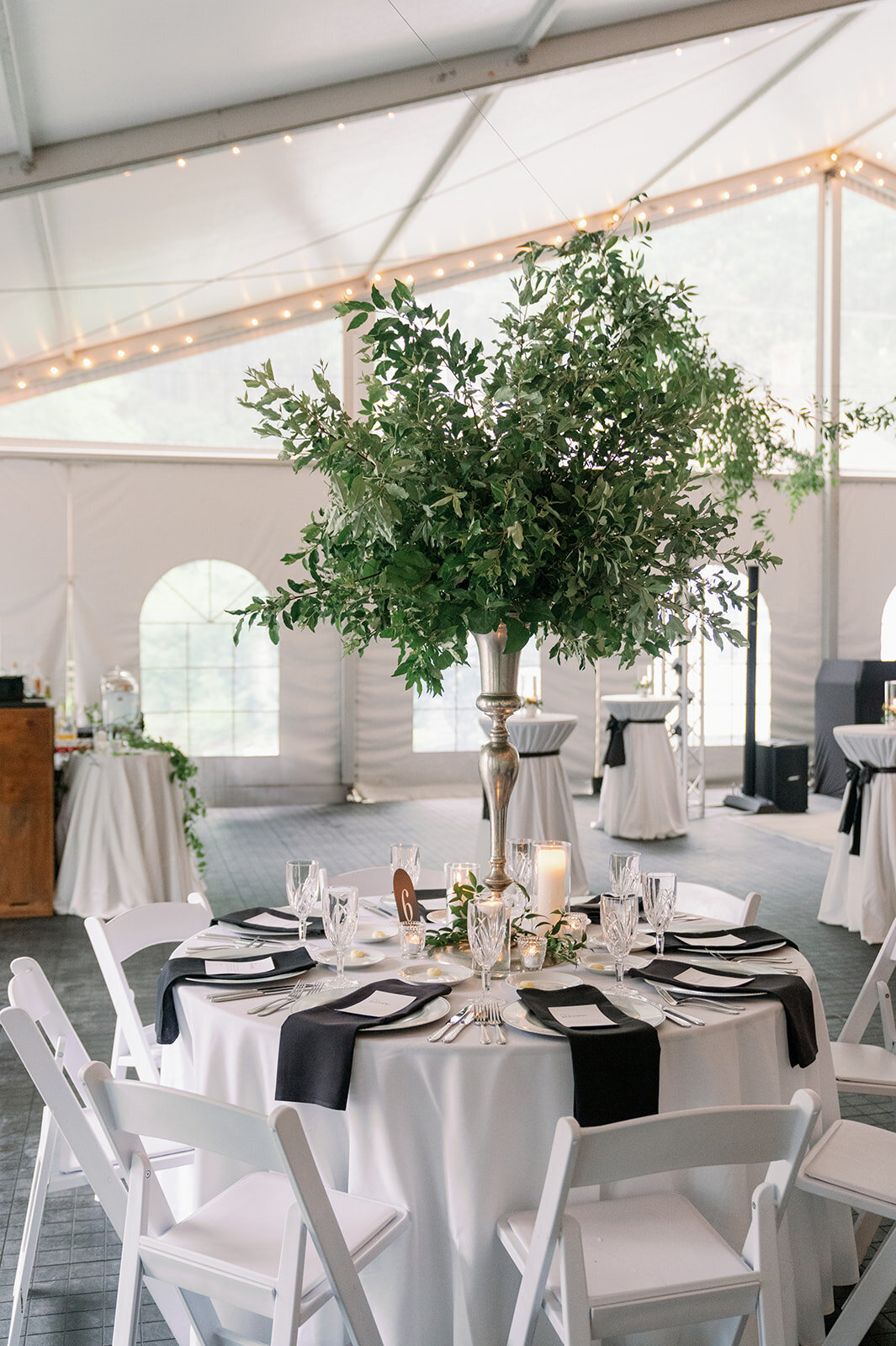 Elegant candlelit reception detail photo with greenery at The Morris Estate wedding in Niles Michigan.