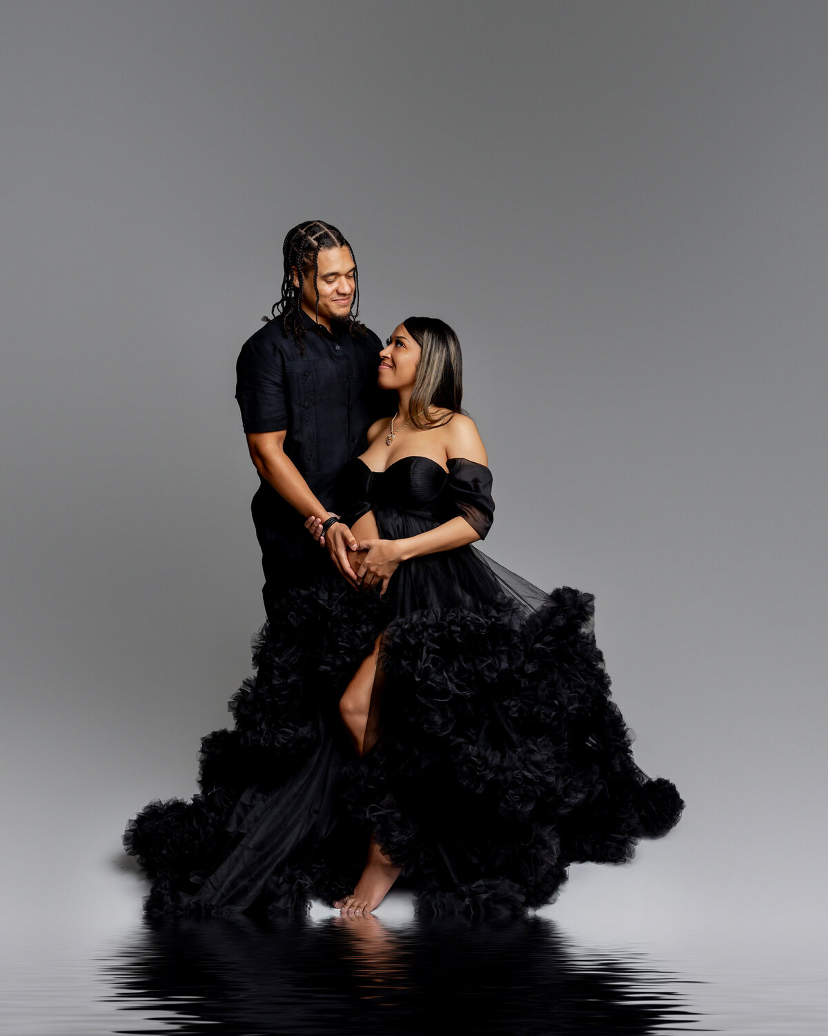 The expecting mother and her husband share a heartfelt moment, as they joyfully prepare for the arrival of their baby. Captured by Inland Empire maternity photographer Kaitlyn Dawn Photography.