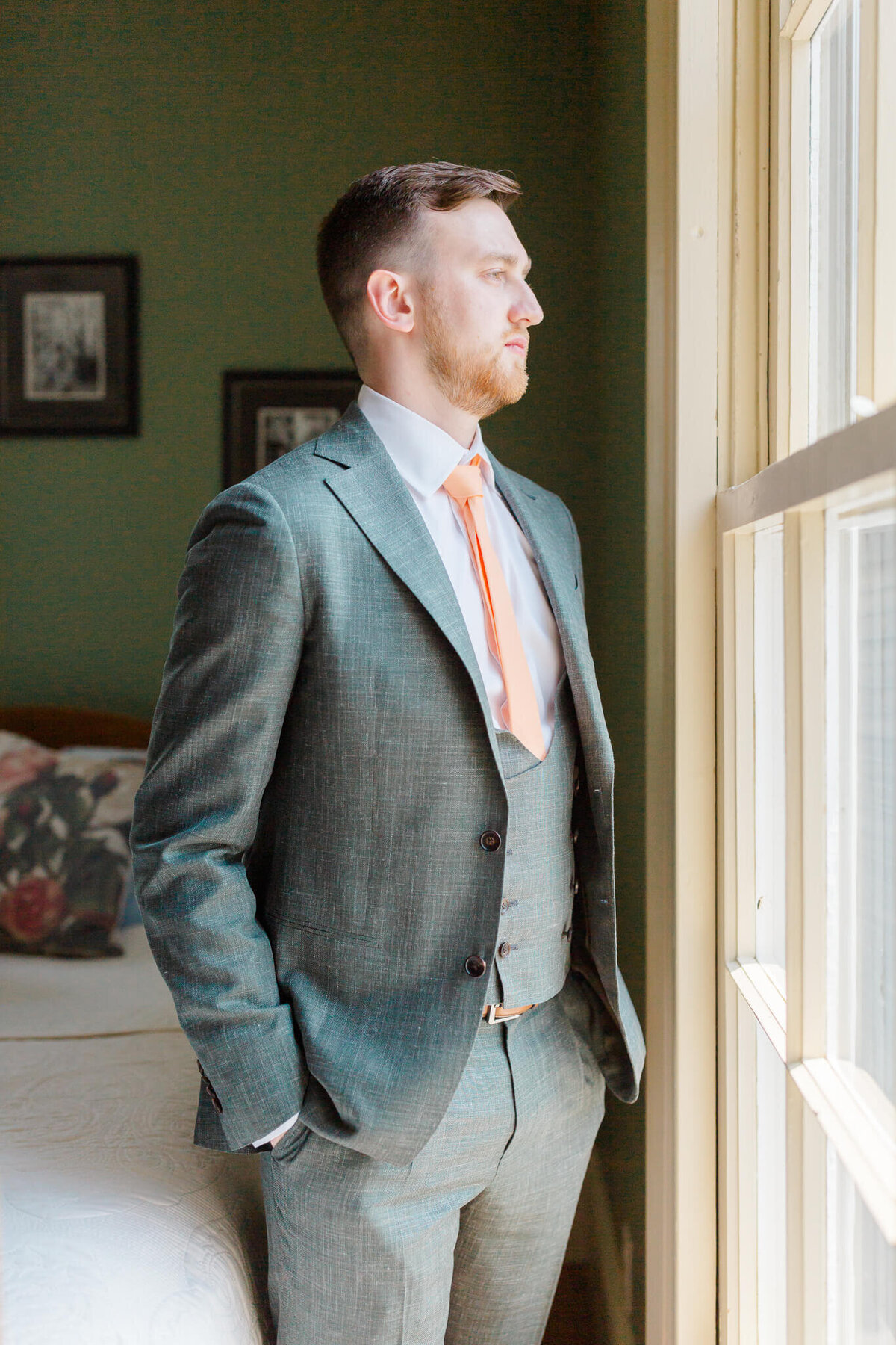 Groom standing by the window at Guildford Farm in Ruckersville, Virginia. Captured by Washington DC Wedding Photographer Bethany Aubre Photography.