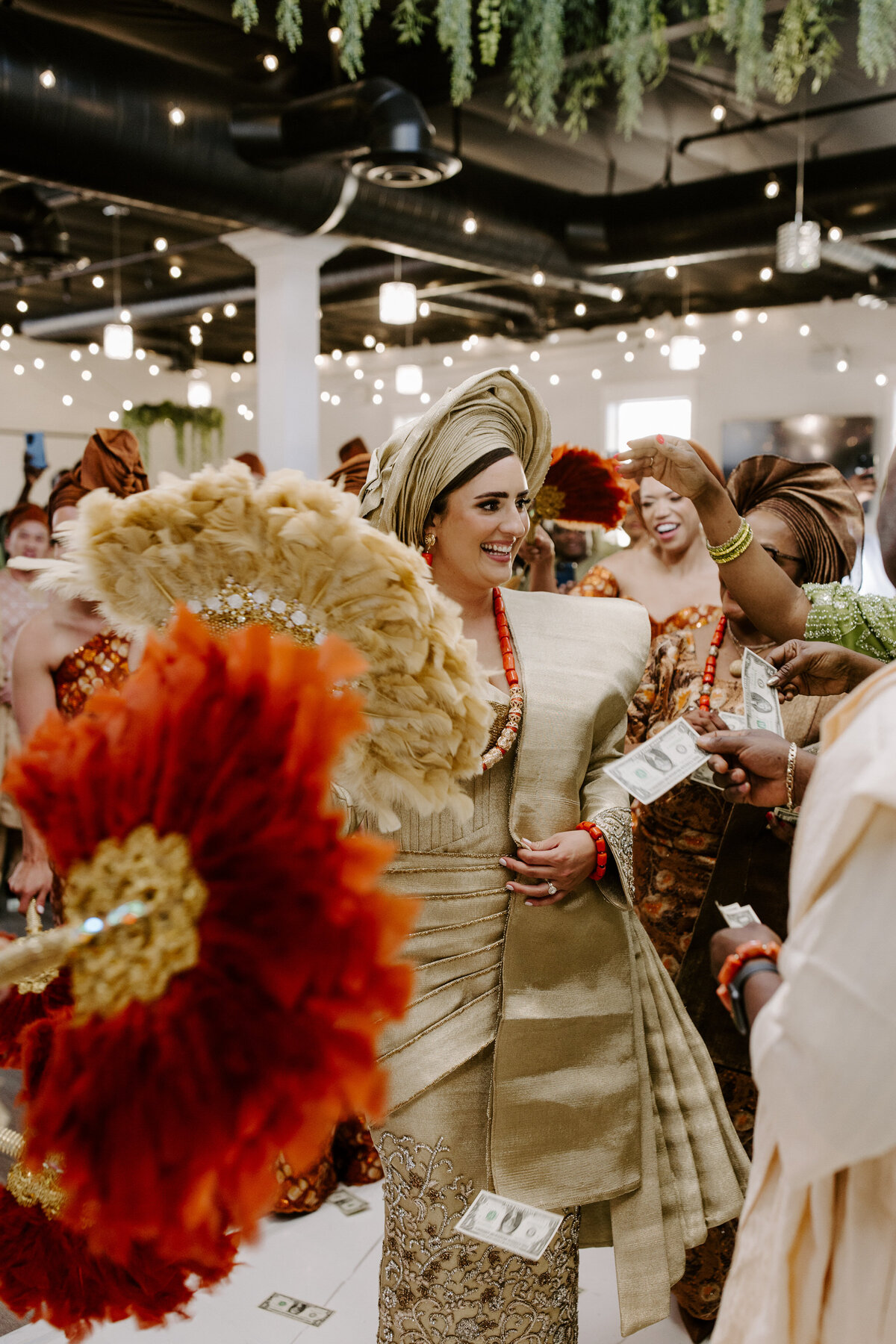 A bride smiles with her family around her.