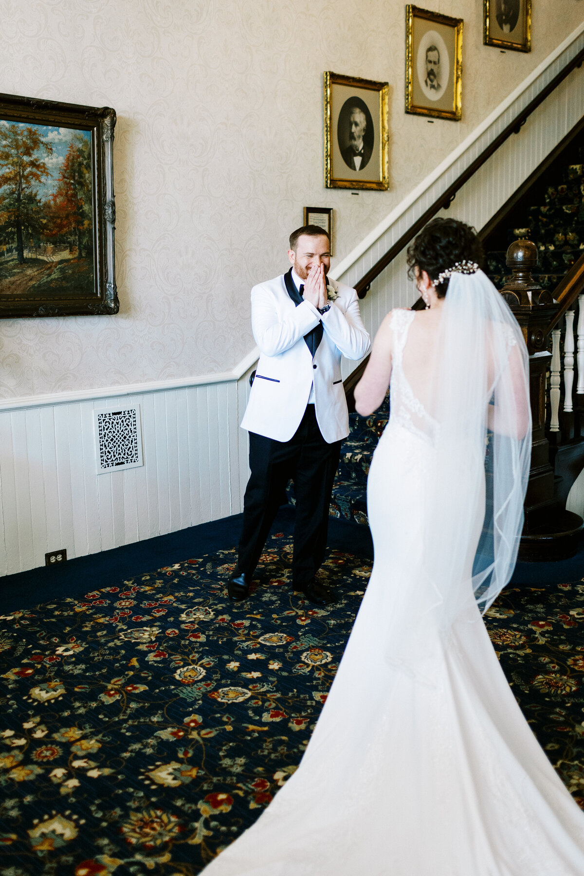 groom sees her for the first time with a joyful emotion