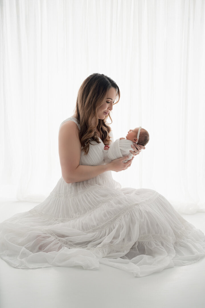 Grand Rapids Newborn Photography Mom Looking At Baby by For the Love of Photography