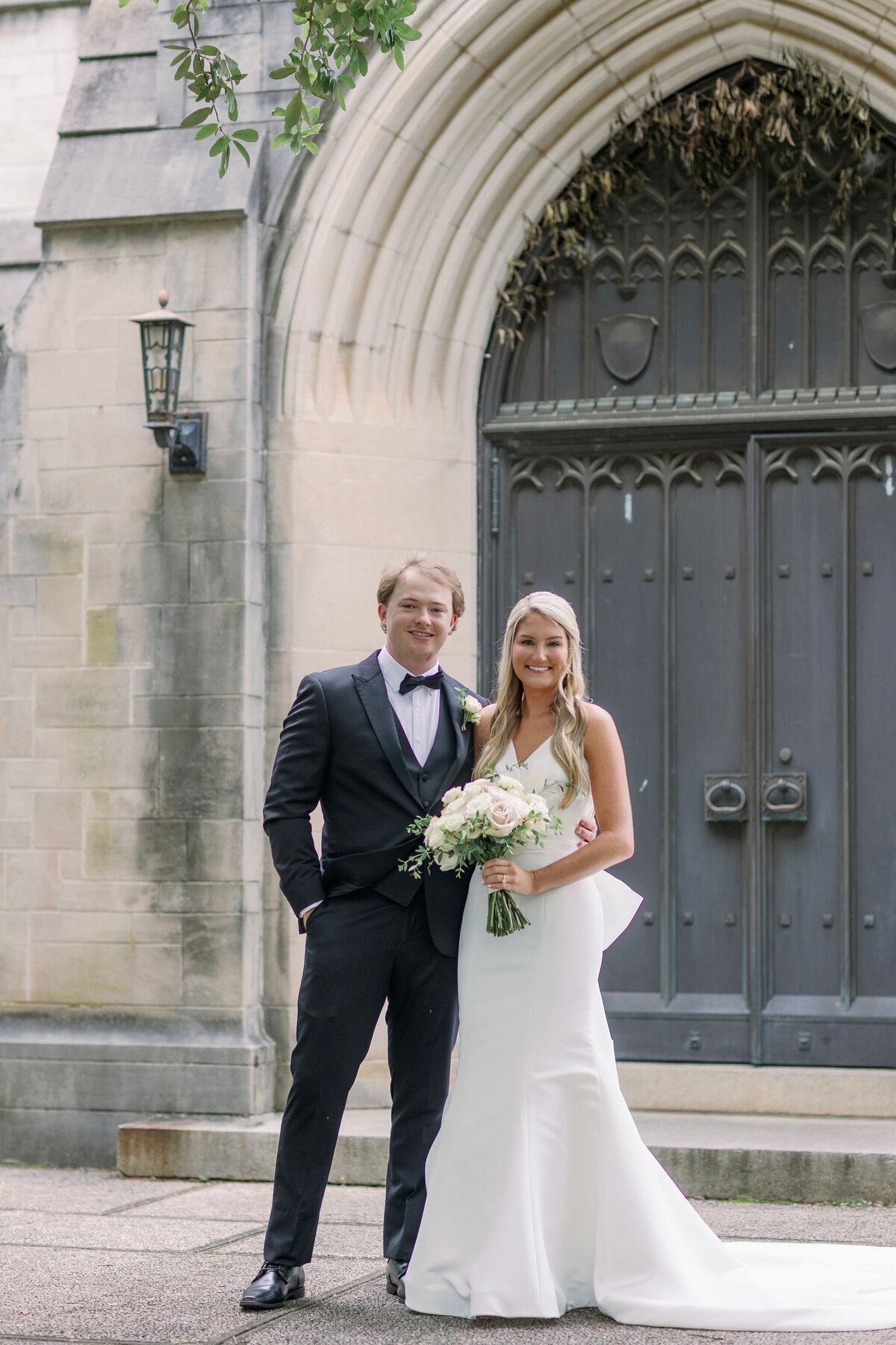 Bride and groom smiling at their venue