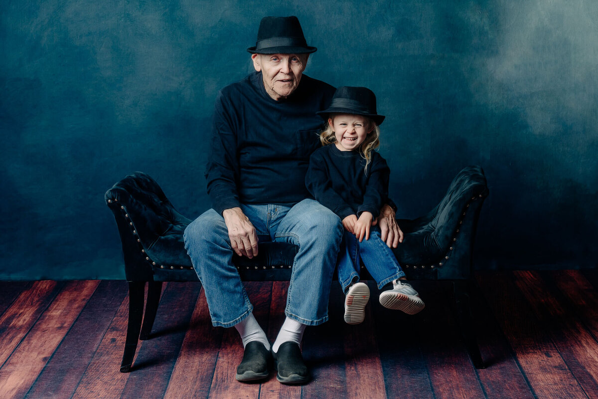 Girl snuggles with grandfather in Prescott family photos