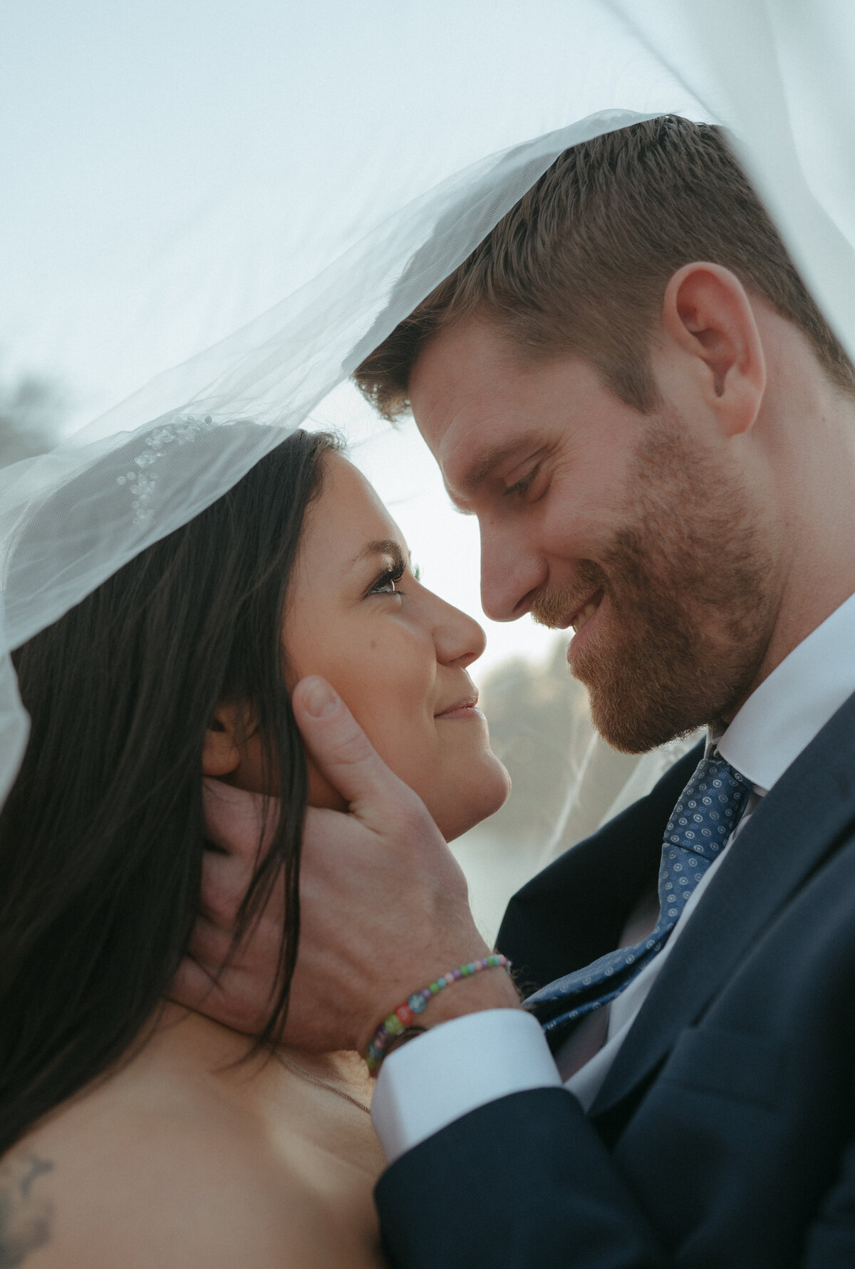 bride and groom holding each other during wedding