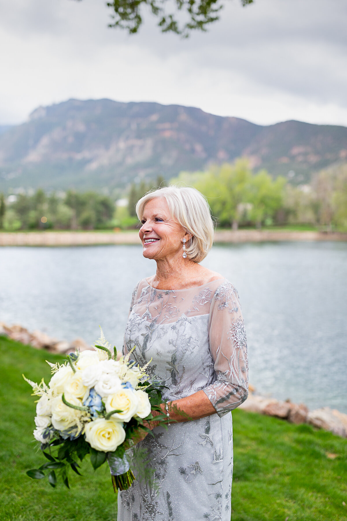 Bride Poses for a Photo by the Lake at the Broadmoor