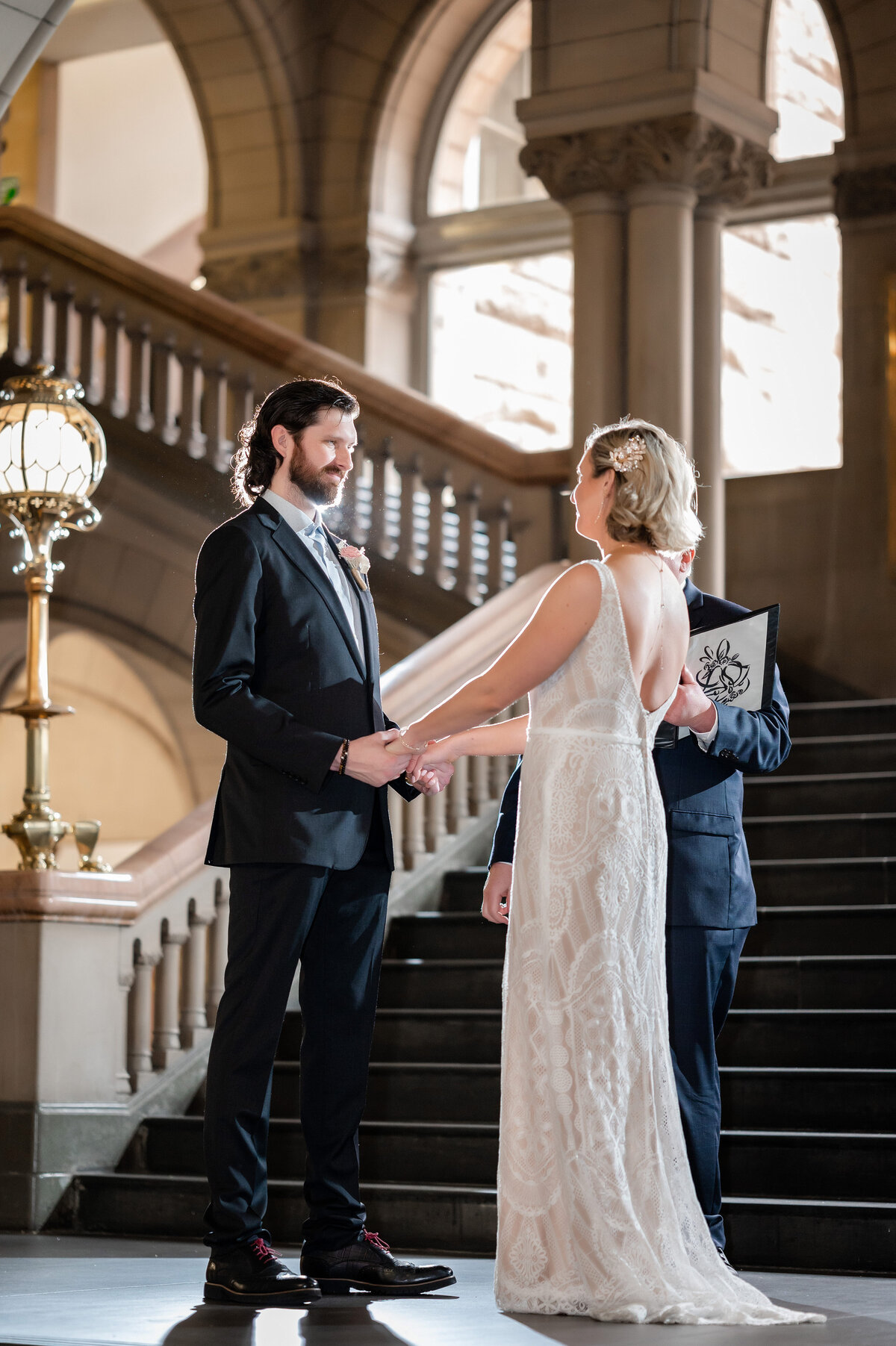 wedding ceremony on staircase at allegheny county courthouse