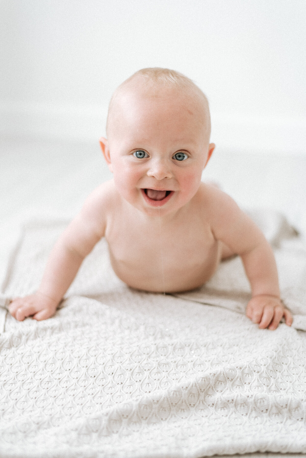 baby boy smiling at Billingshurst milestone photography session