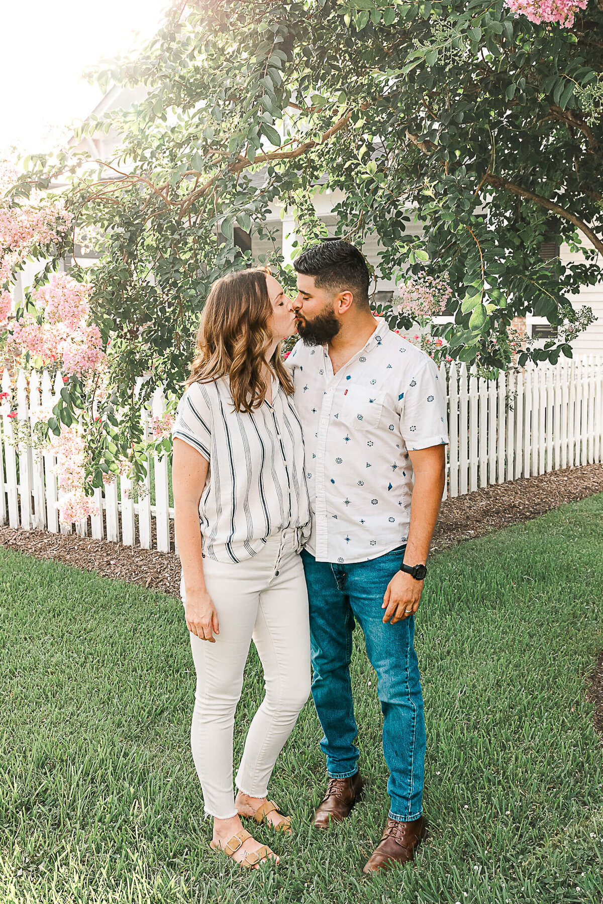 Couple near white fence