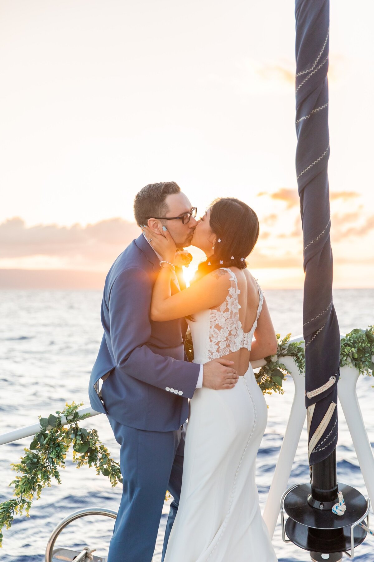 kiss at sunset during Maui wedding photos