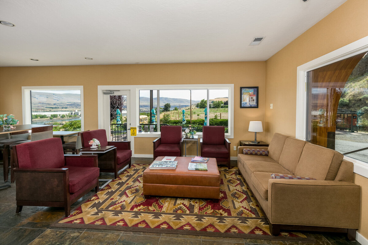 Waiting area at Celilo inn with outside view, comfortable sofa with magazines