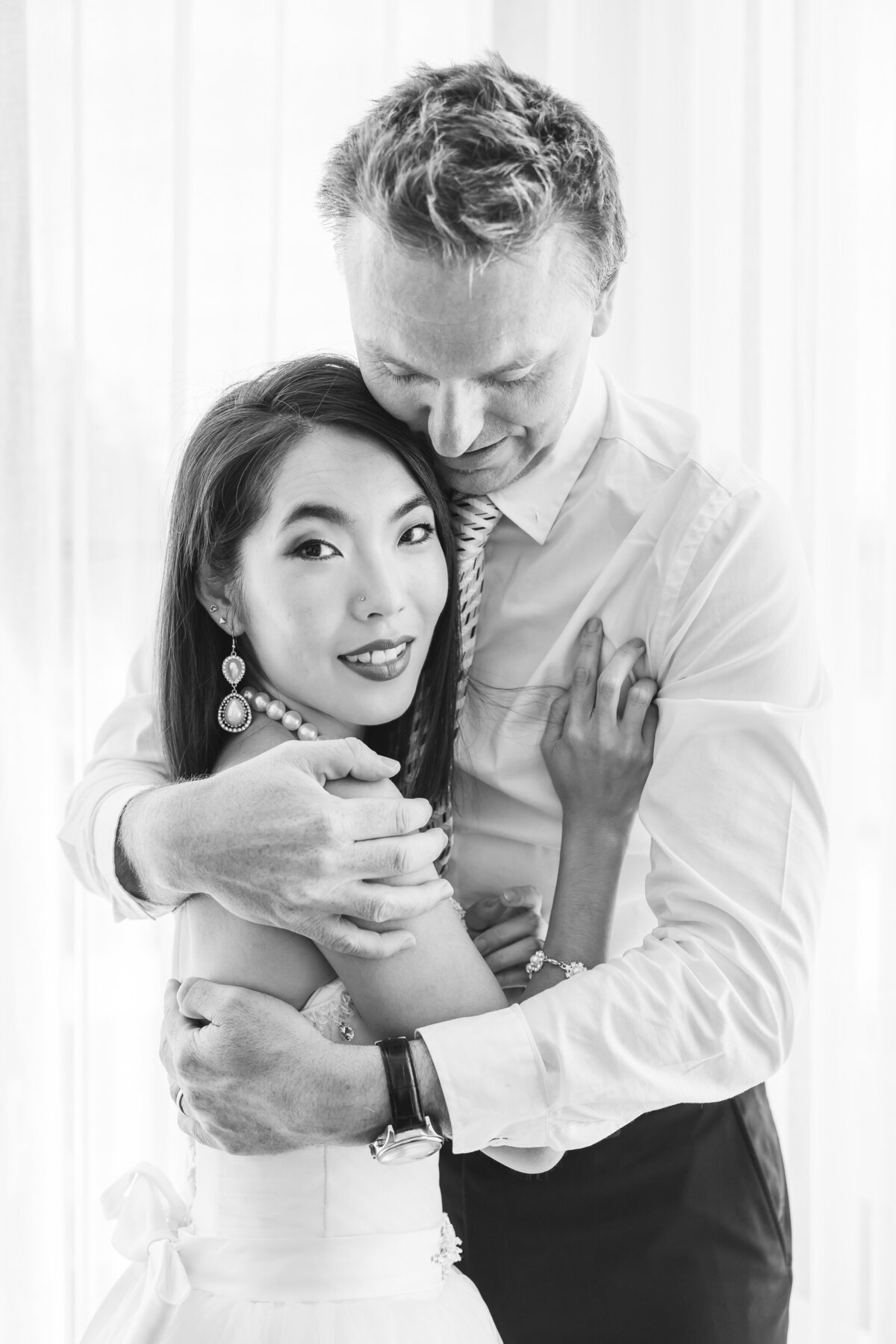 bride and groom embracing