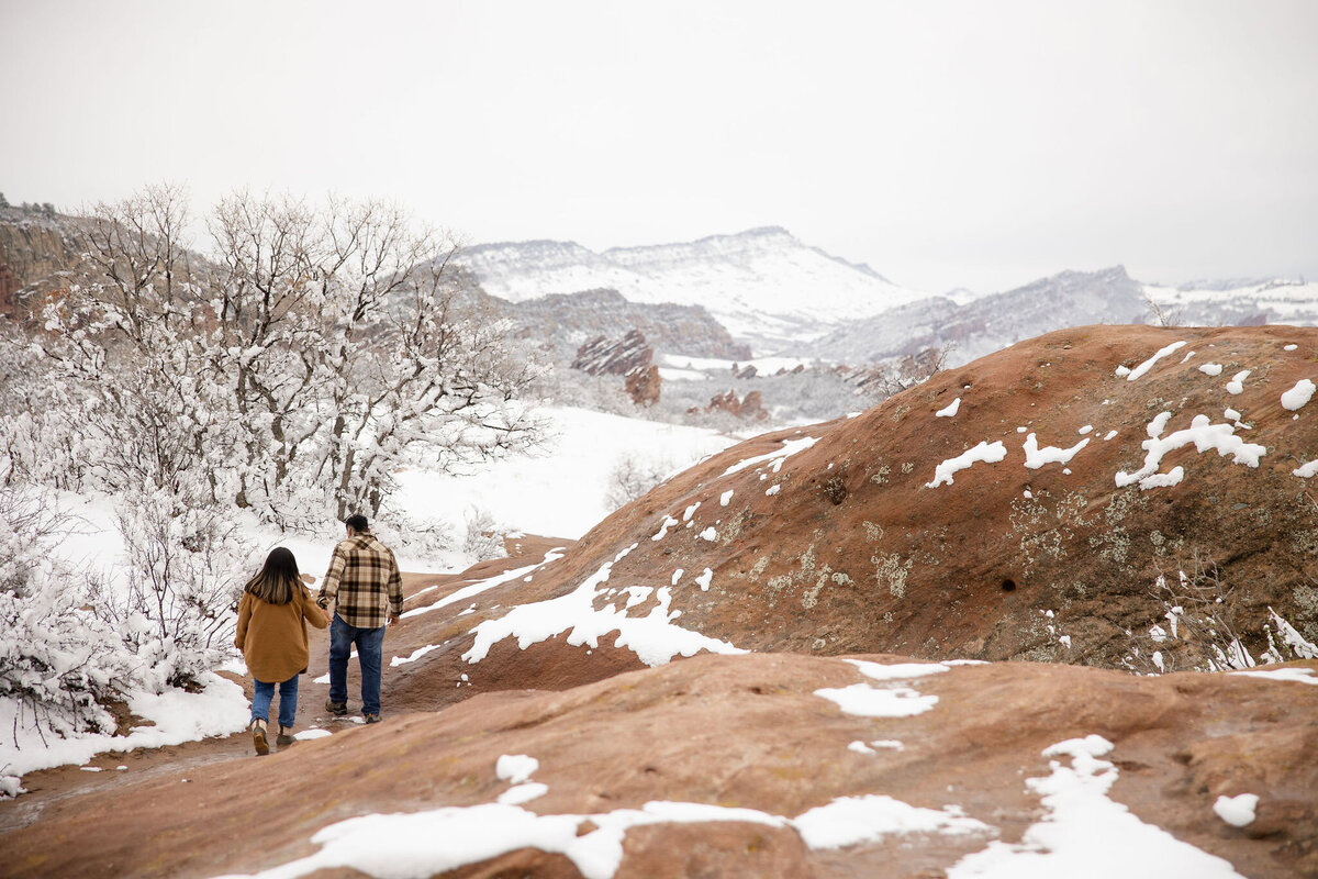 An intimate engagement session set in Littleton, Colorado, featuring panoramic mountain views and romantic moments for the perfect vacation memory