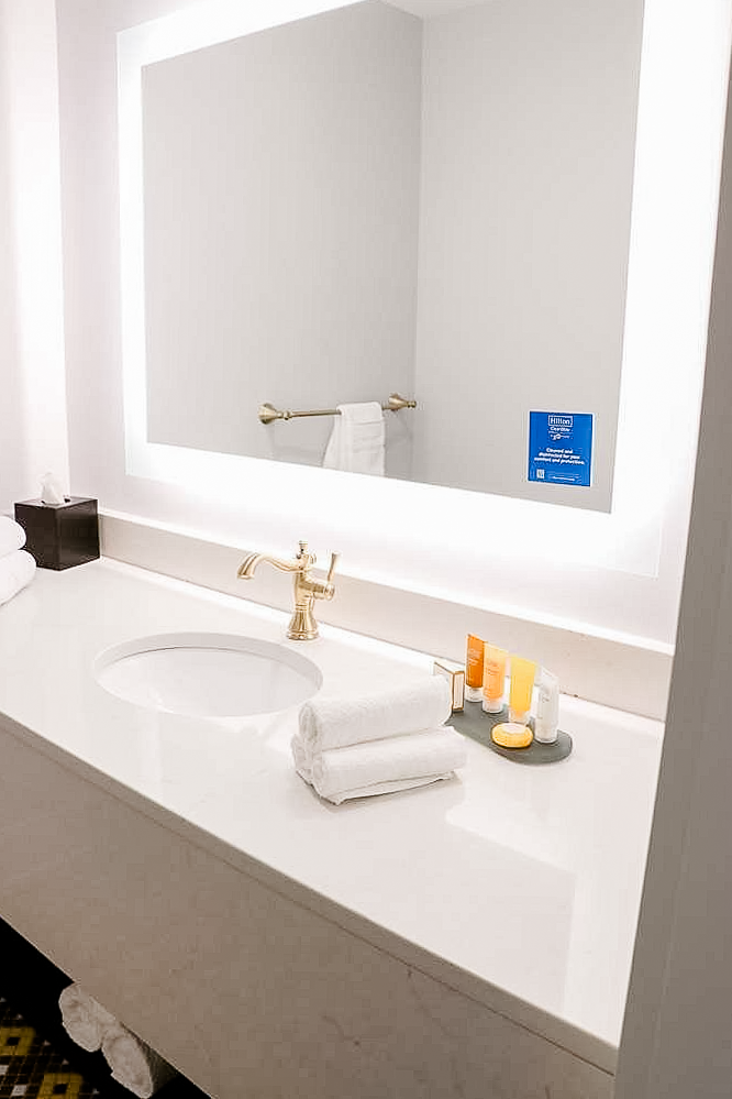 Boutique hotel guest bathroom with ornate faucet