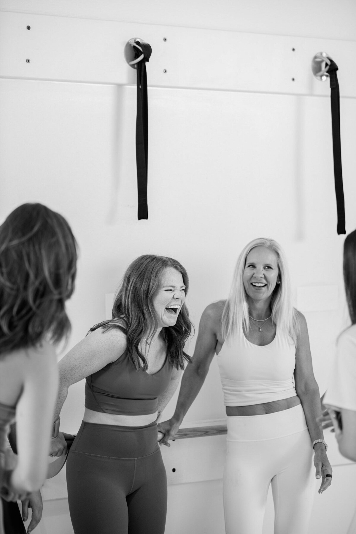 Women laughing and smiling  in workout clothes