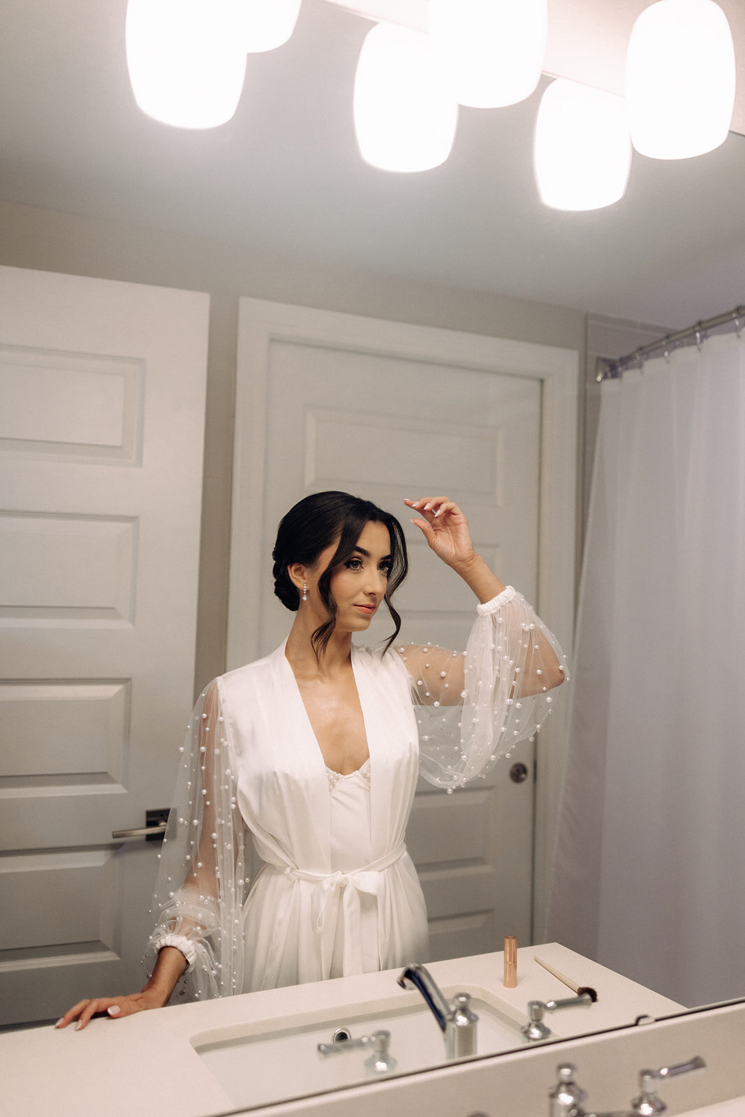 bride getting ready at bella collina wedding venue​