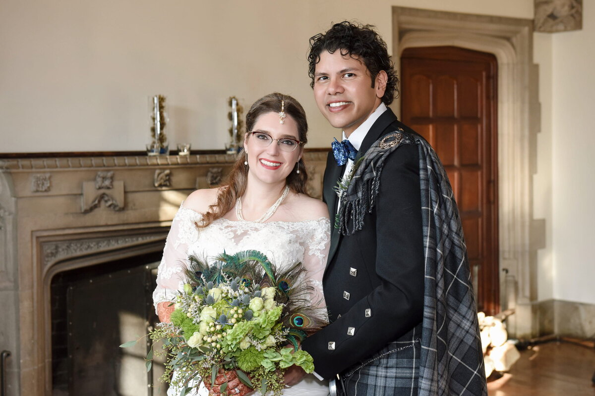 Bride and Groom Posing by Fireplace 