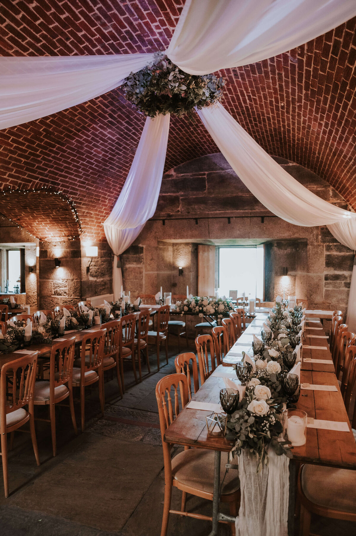 A long table set up for a wedding reception