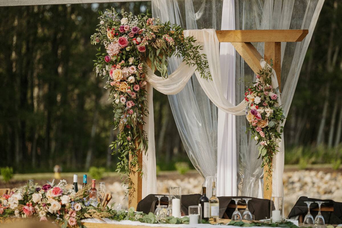 gorgeous ceremony florals at edmonton wedidng reception