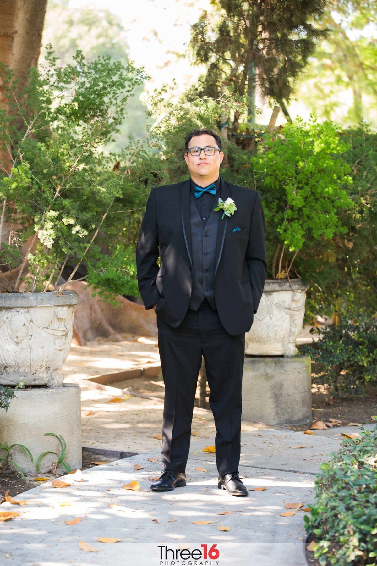 Groom posing for the wedding photographer