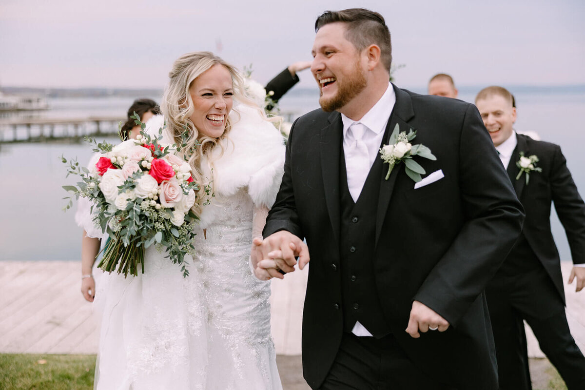 Bride and groom looking happy after wedding ceremony at The Lake House on Canandaigua