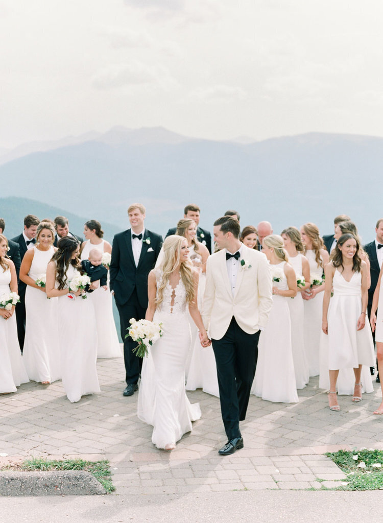 A happy just-married couple at a mountain top wedding