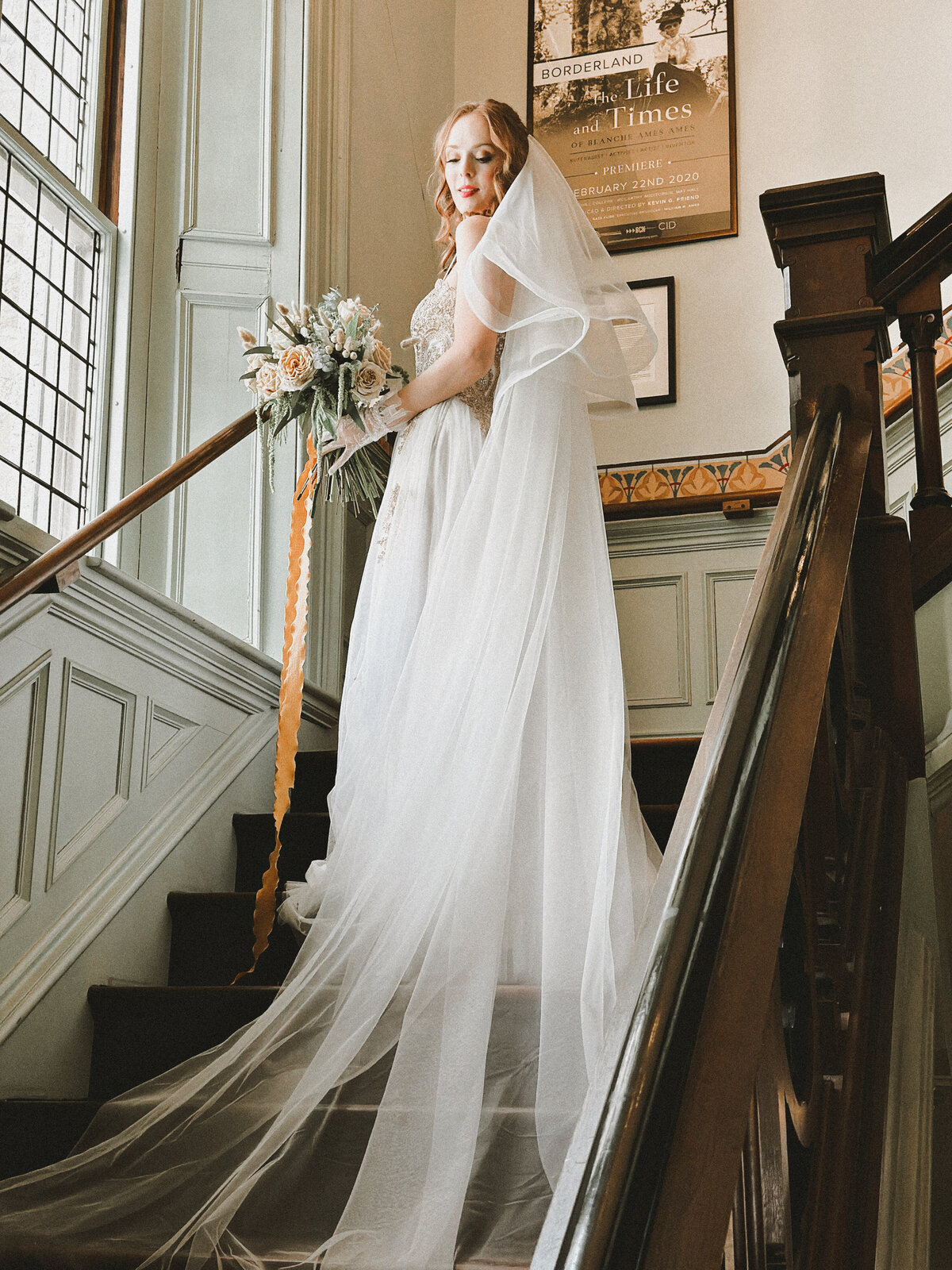 Close-up of lace and pearl details on ivory blusher veil

