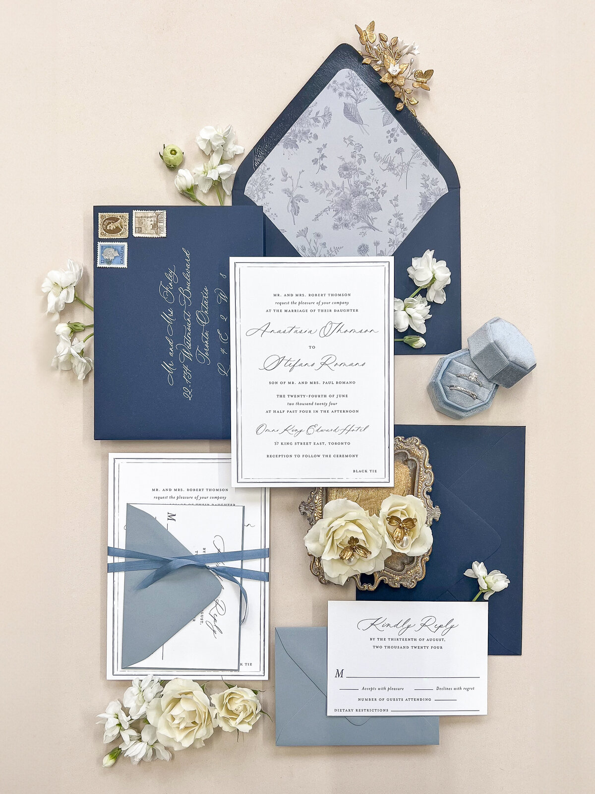 Romantic floral-inspired wedding invitations in soft and deep blue tones