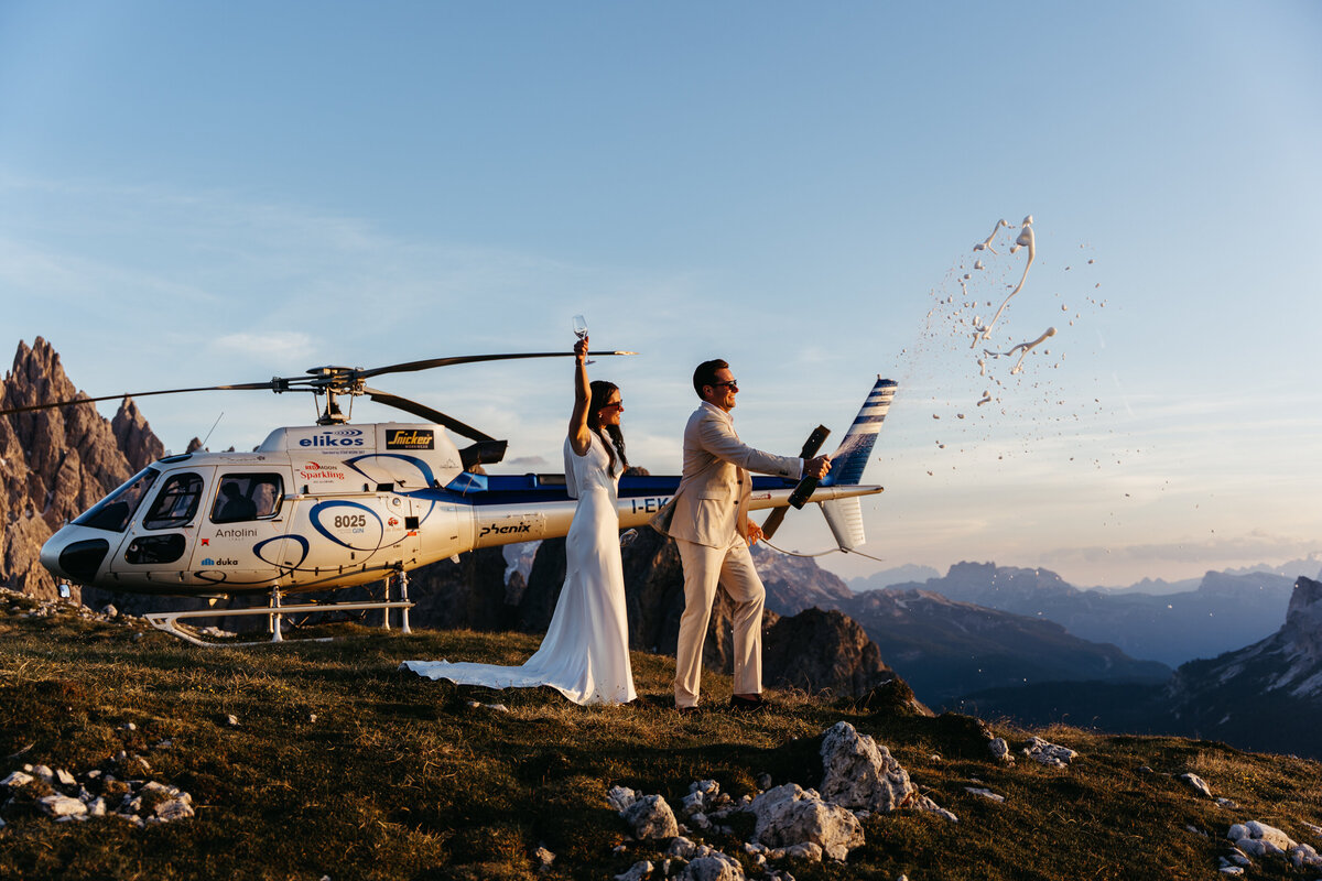Helicopter flying over Dolomites peaks