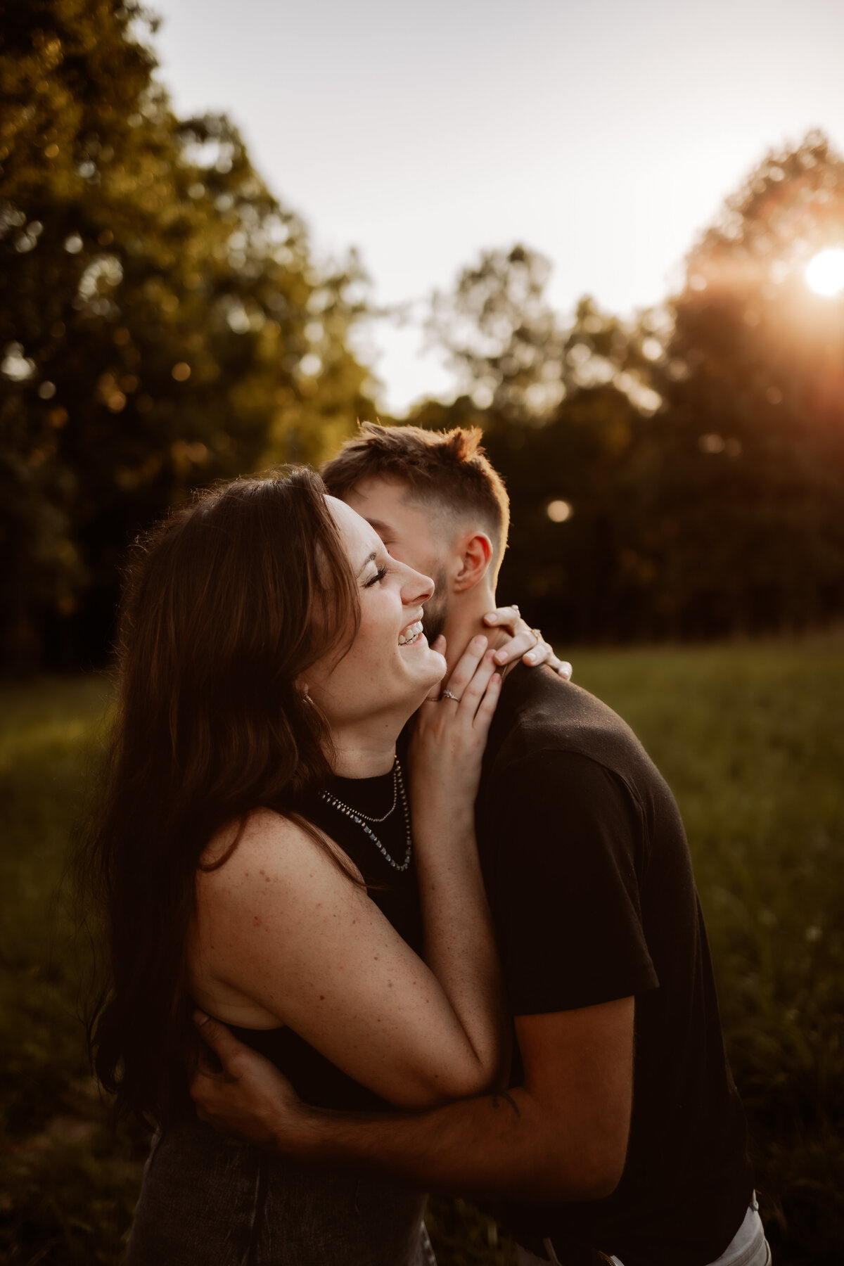 Photo of a senior in highschool posing in a field during golden hour in Bloomington , Indiana