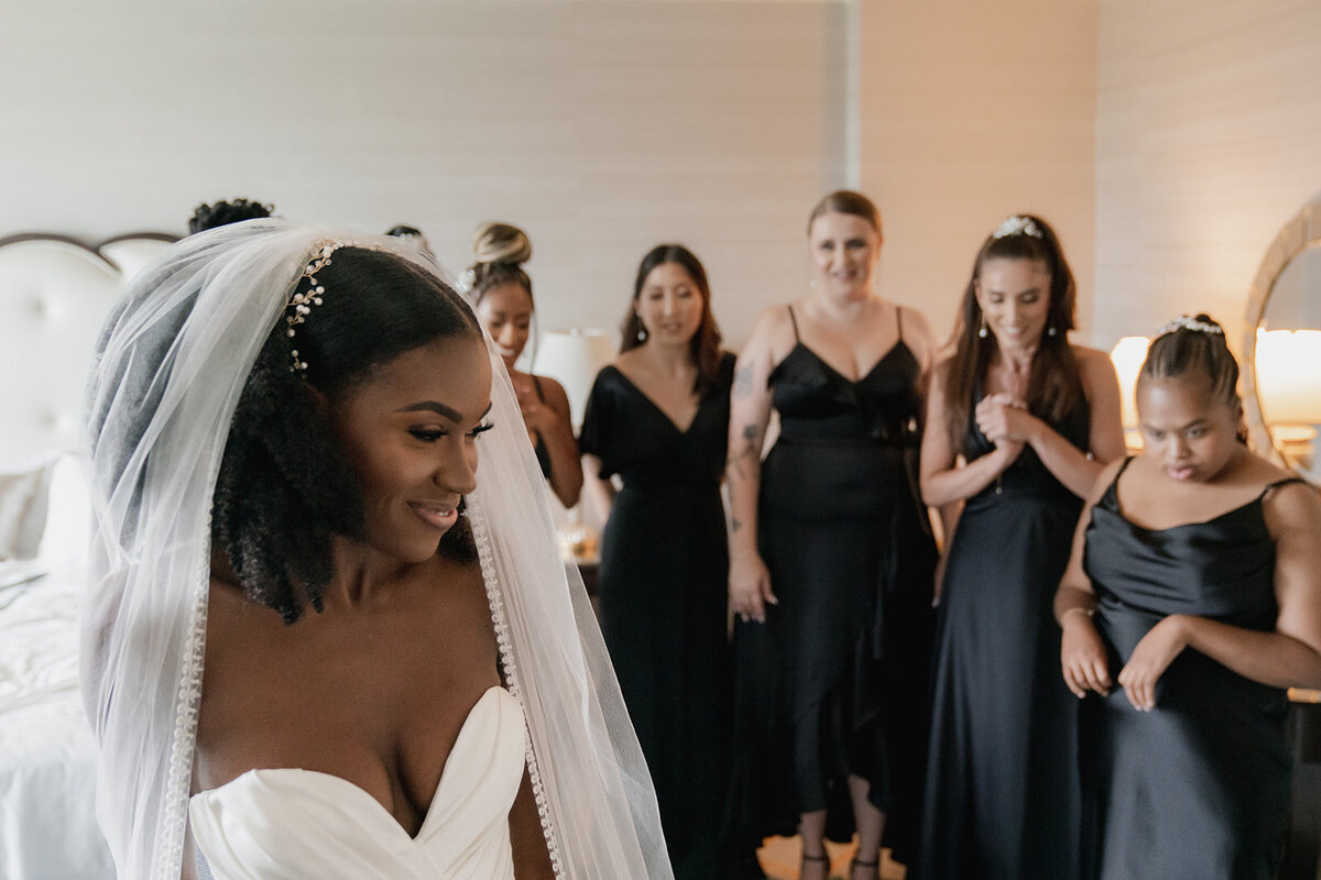 black bride with wedding party dressed in black gowns