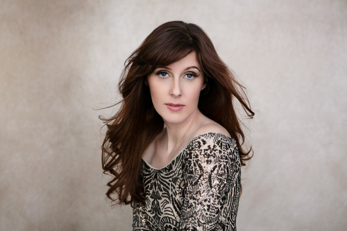 Professional beauty portrait of woman in sparkling dress