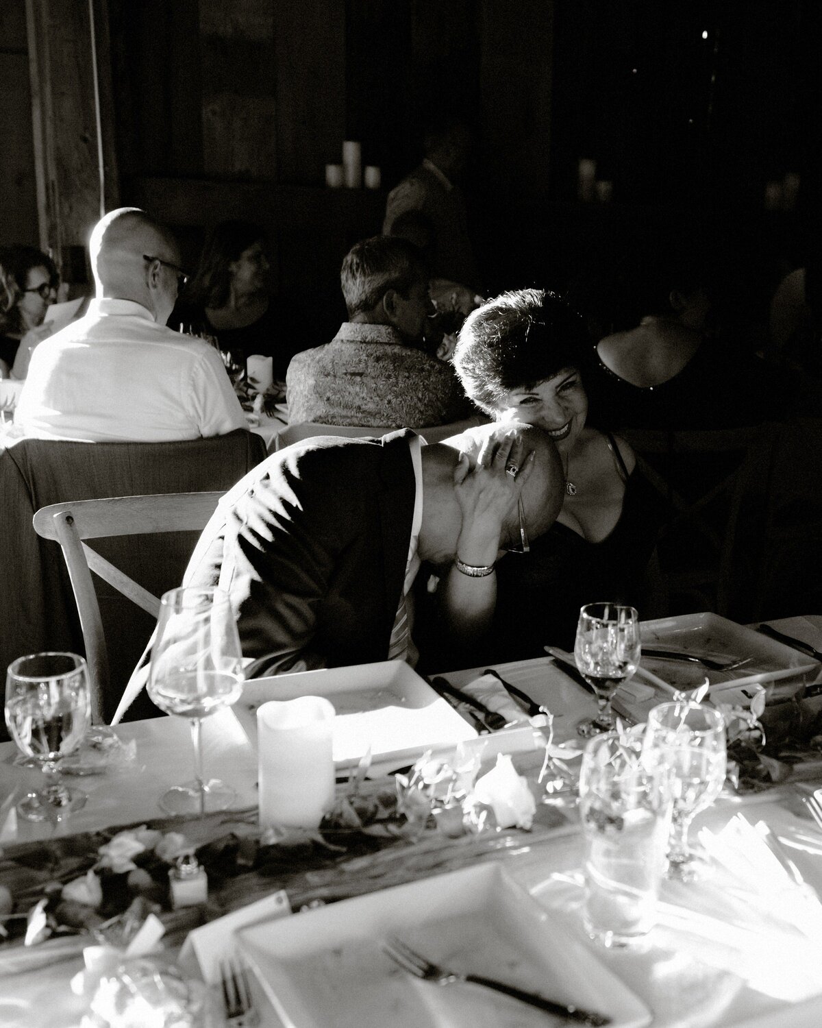 parents of the groom sharing a sweet moment during speeches