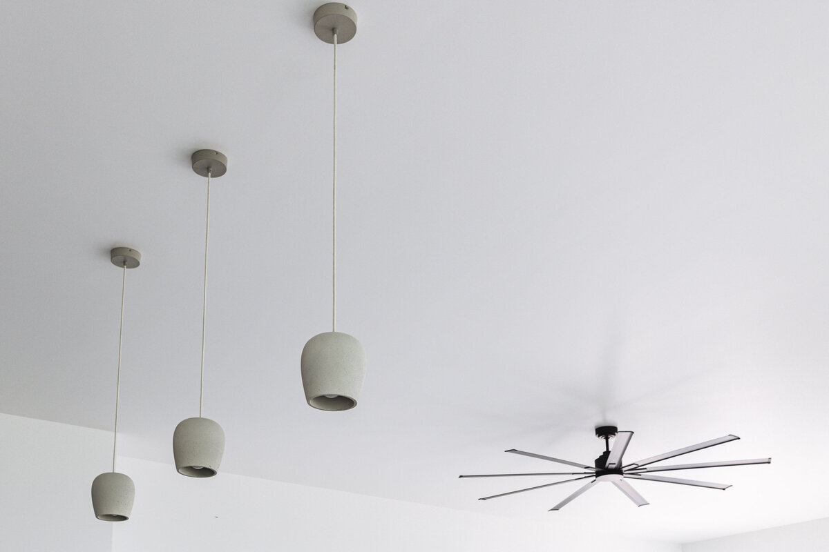 Stunning light fixtures in custom built home by wbk building