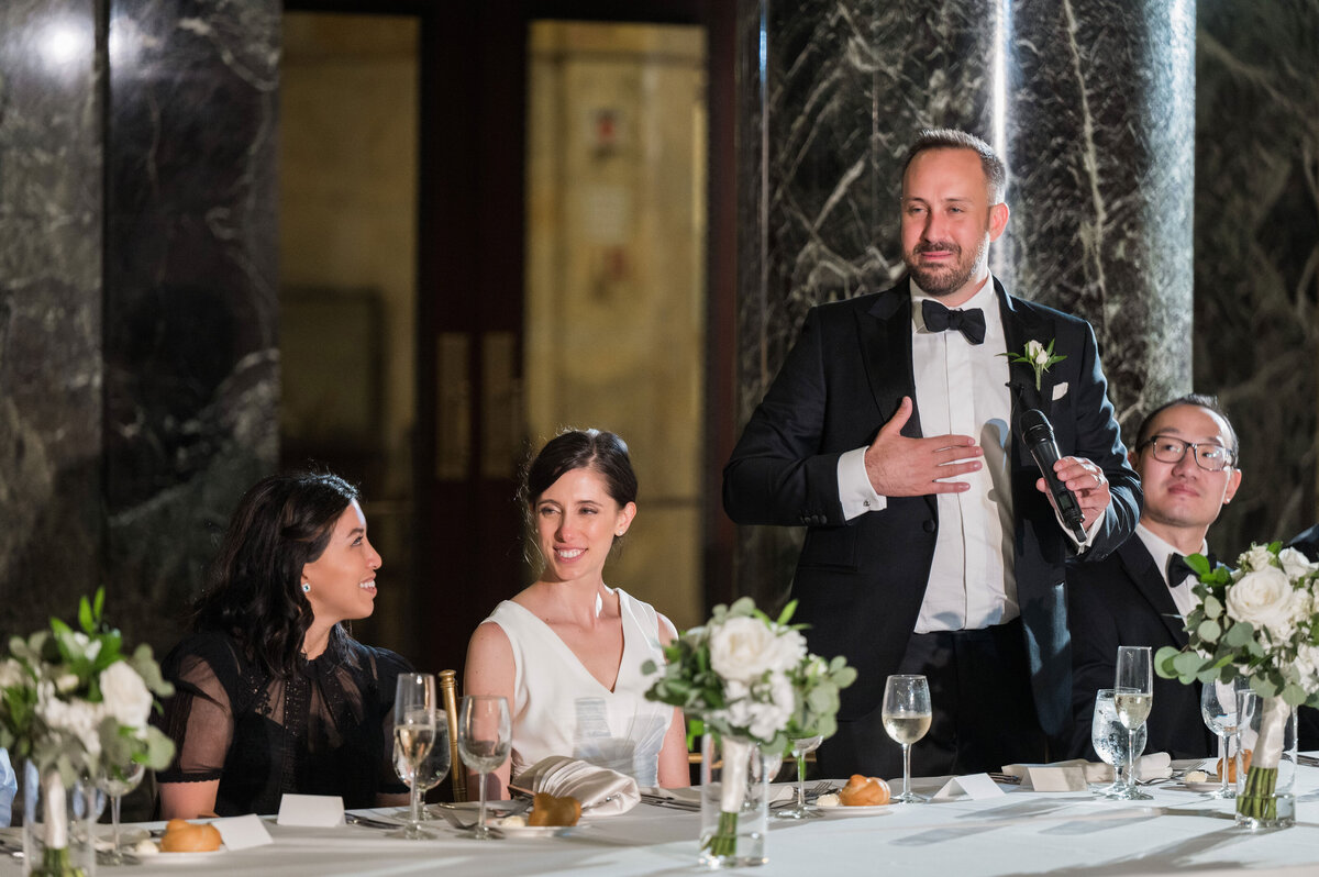 groom giving a toast during carnegie museum wedding